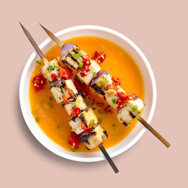Grilled tofu skewers with soy and sesame marinade and roast vegetables